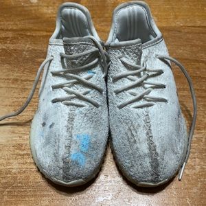 Really used Adidas Yeezy sneaker. Not sure if the blue stain will come out!